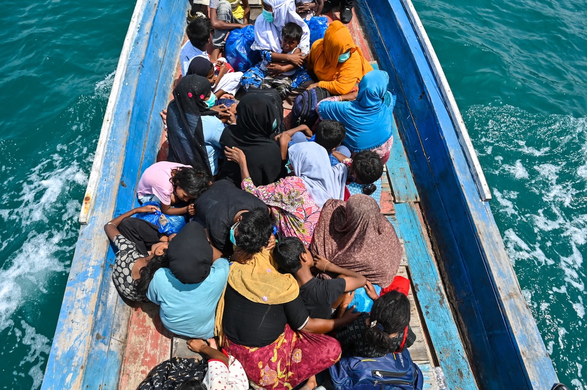 In this file photo, Rohingya refugees wait to be rescued from a boat after a week anchored ashore off the coast of Southern Aceh, Indonesia on Oct. 24, 2024. (AFP)
