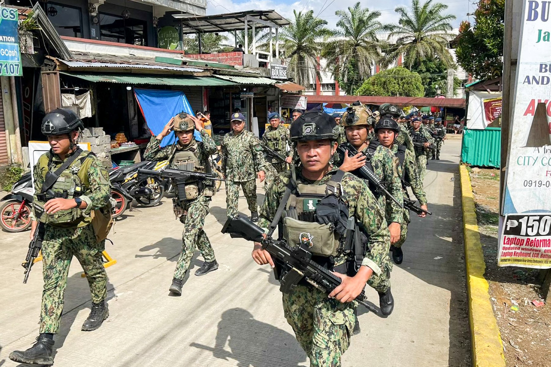 In this file photo, policemen and soldiers arrive at Mindanao State University in Marawi City, Lanao del Sur province on Dec. 4, 2023. (AFP)