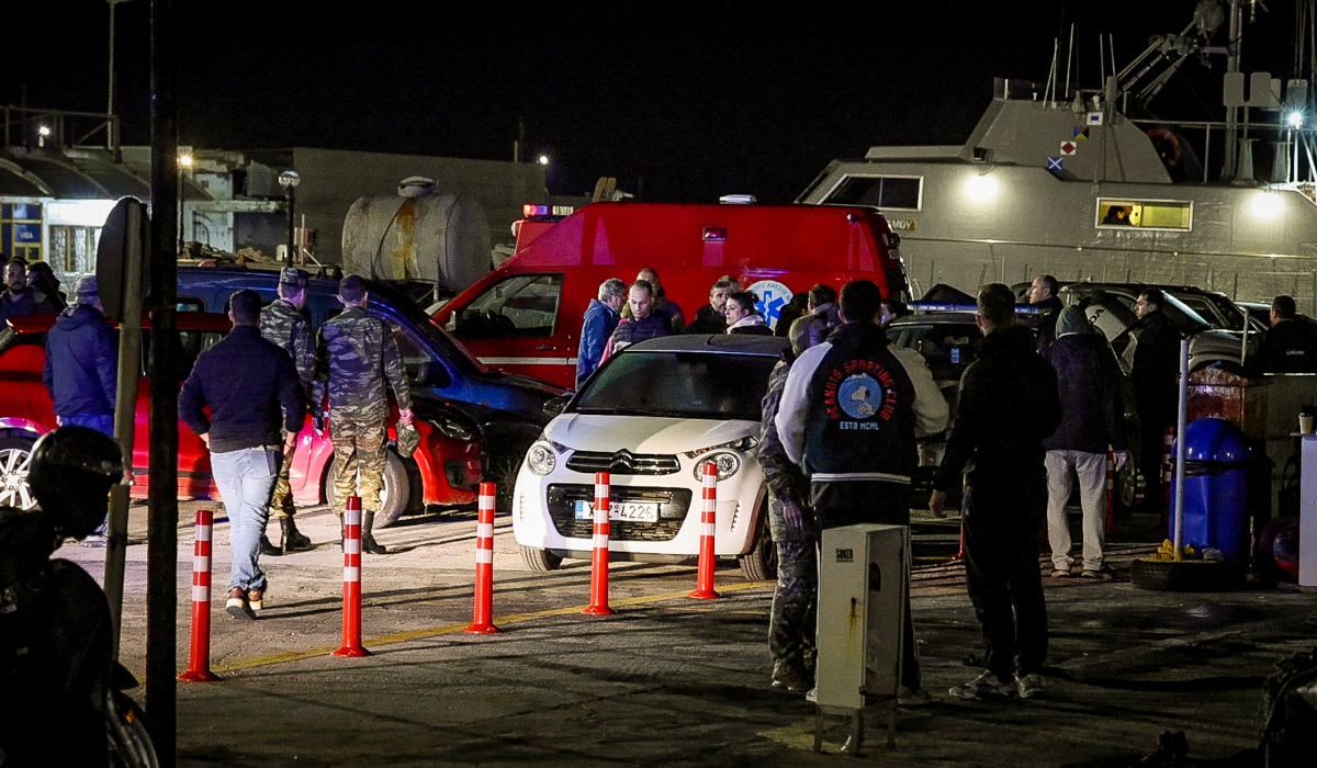 An ambulance, paramedics and soldiers are seen at the port on the eastern Aegean island of Chios, on February 4, 2026, following a migrantís boat collision with Greek coastguards. (AFP file photo)