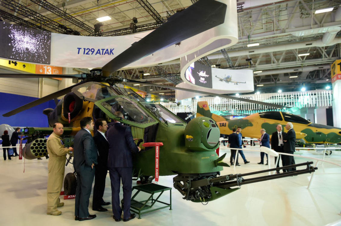 A Turkish attack helicopter "T129 ATAK" is displayed during the defense exhibition in Istanbul in this file photo. Turkiye and Nigeria have inked a defense cooperation agreement as the west African nation struggles to contain jihadist violence and criminal gangs. (AFP file photo)