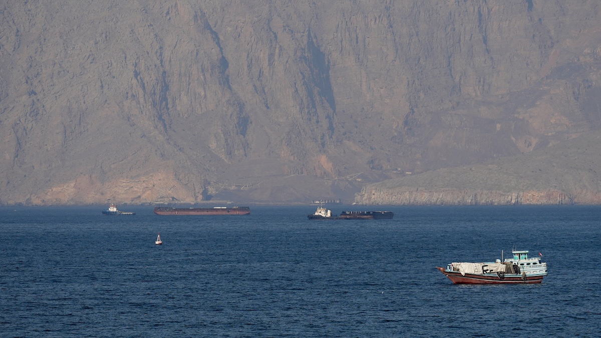 Above, vessels in the Strait of Hormuz off the coast of Musandam, Oman on April 18, 2026. (Reuters)