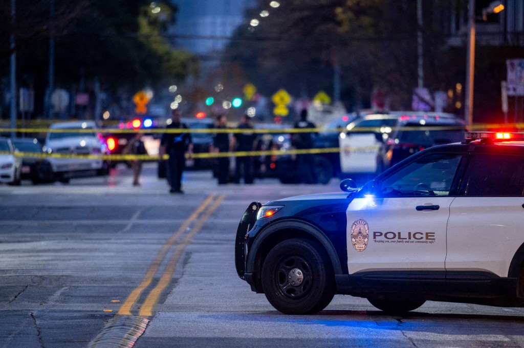 Law enforcement patrol an intersection near Buford's bar in downtown Austin, Texas. (Files / AFP)