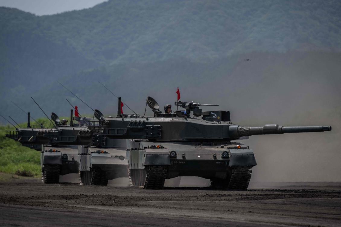 Japan Ground Self-Defence Force (JGSDF) battle tanks take part in a live fire exercise at East Fuji Maneuver Area in Gotemba on May 27, 2023. (AFP)