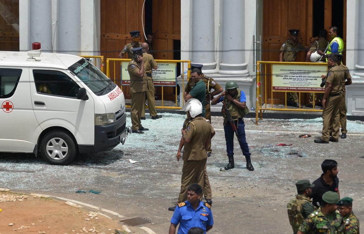 Sri Lankan security personnel stand next to an ambulance outside St. Anthony’s Shrine in Kochchikade in Colombo on April 21, 2019 following a blast at the church. (AFP file photo)