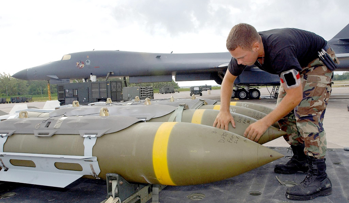 A US Air Force weapons loader from the 28th Air Expeditionary Wing preps a 2,000-pound bomb to be loaded into a B-1B Lancer bomber at Diego Garcia air base 22 October 2001. (AFP)