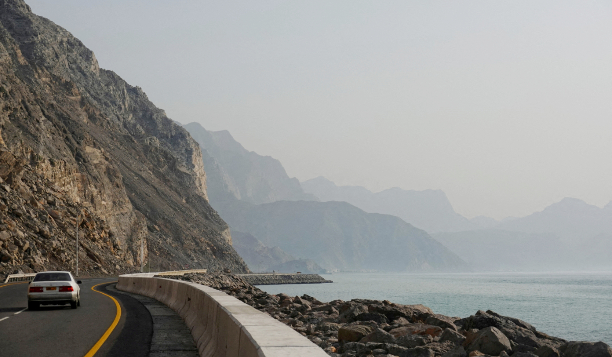 A car rides along the coast of Musandam overlooking the Strait of Hormuz amid the U.S.-Israeli conflict with Iran, Oman, March 2, 2026. 9REUTERS)