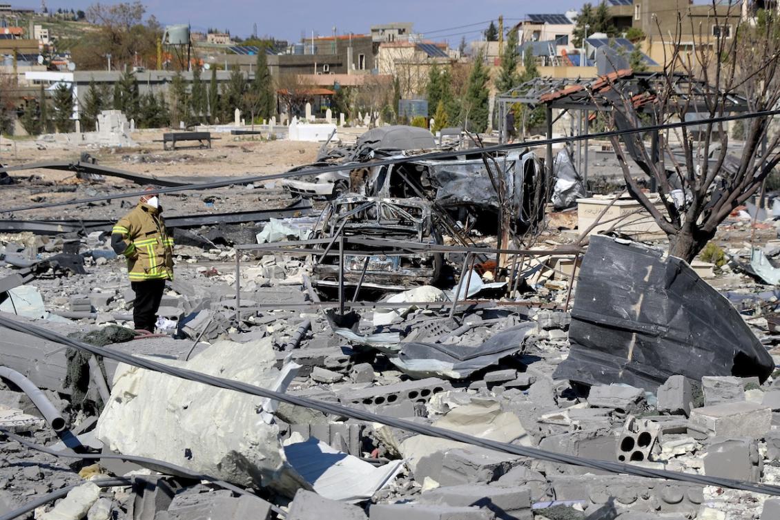 A civil defence member inspects destroyed vehicles and rubble and debris in the aftermath of Israeli bombardment on the village of Shmistar in the centre of Lebanon's eastern Bekaa valley on April 8, 2026. (FILE/AFP)