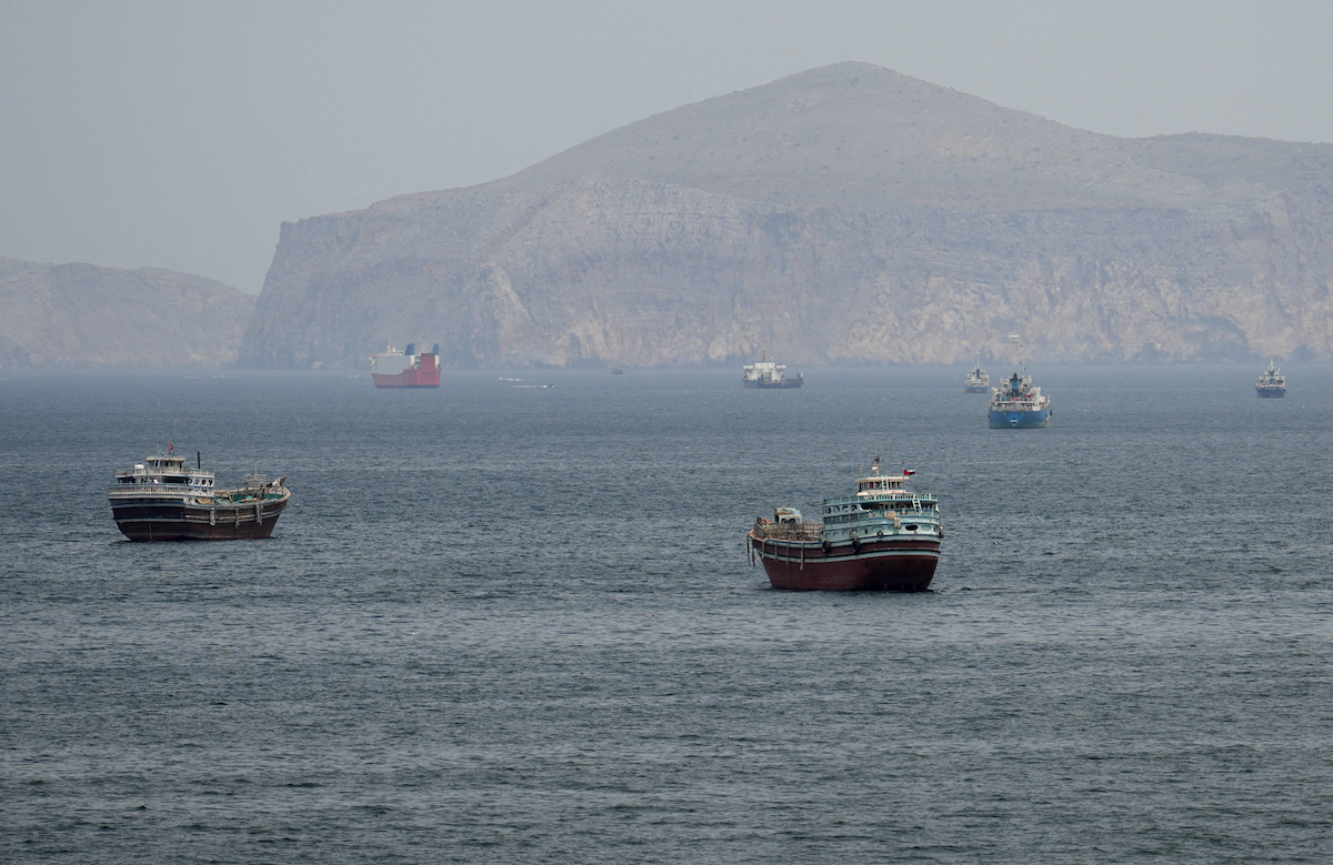 Ships and boats in the Strait of Hormuz off the coast of Musandam, Oman, on Wednesday. (Reuters)