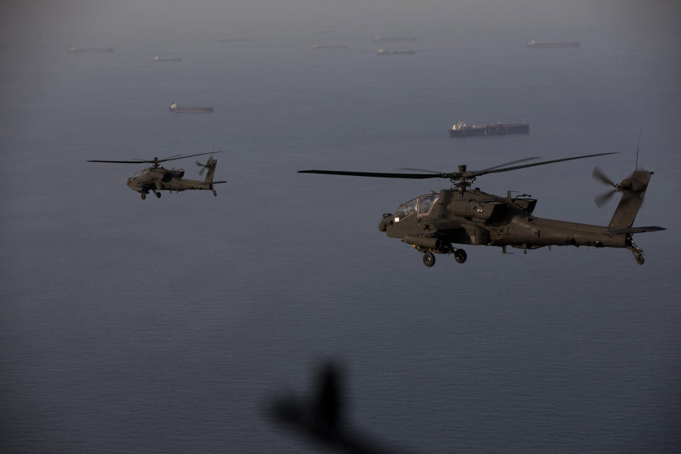 This handout photo released by US Central Command via their X account (@CENTCOM) on April 18, 2026 shows AH-64 Apaches flying above the Strait of Hormuz during a patrol on April 17, 2026. (FILE/AFP)