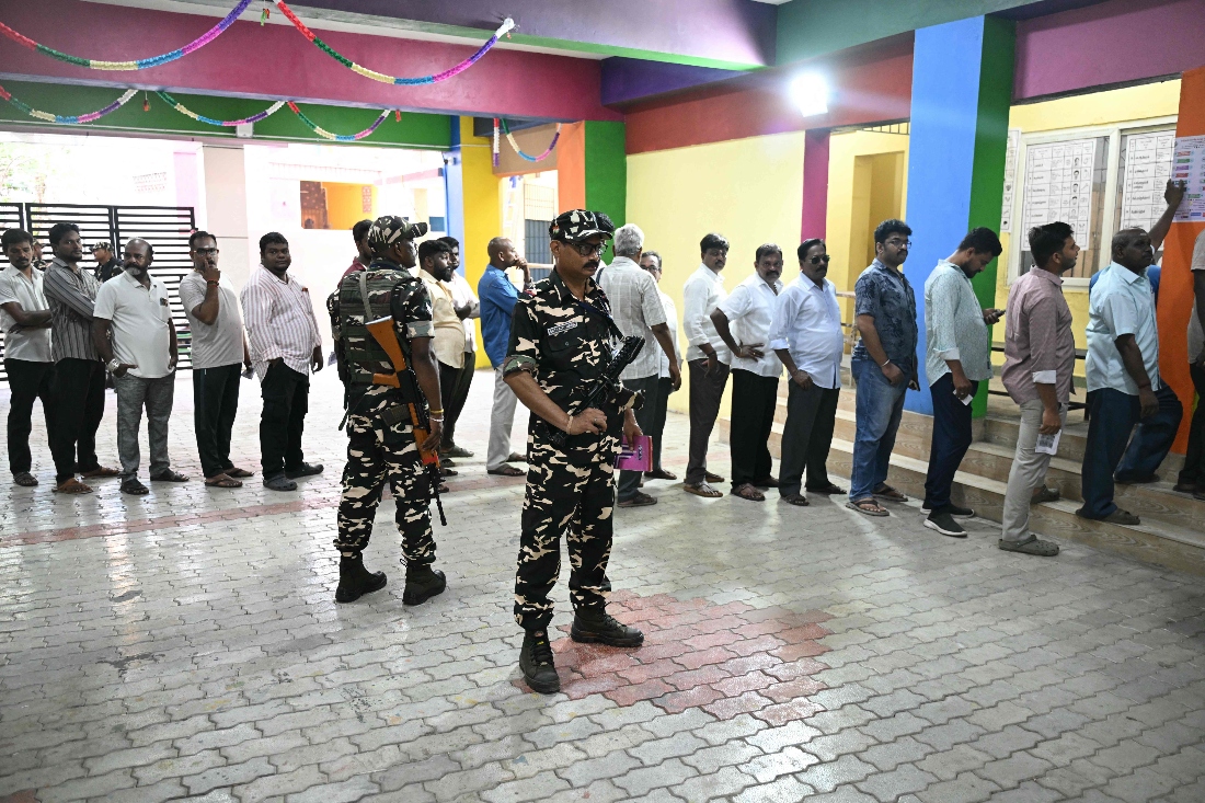 Voters queue to cast their vote outside a polling station during the 2026 Tamil Nadu Legislative Assembly elections in Chennai, India. (AFP)