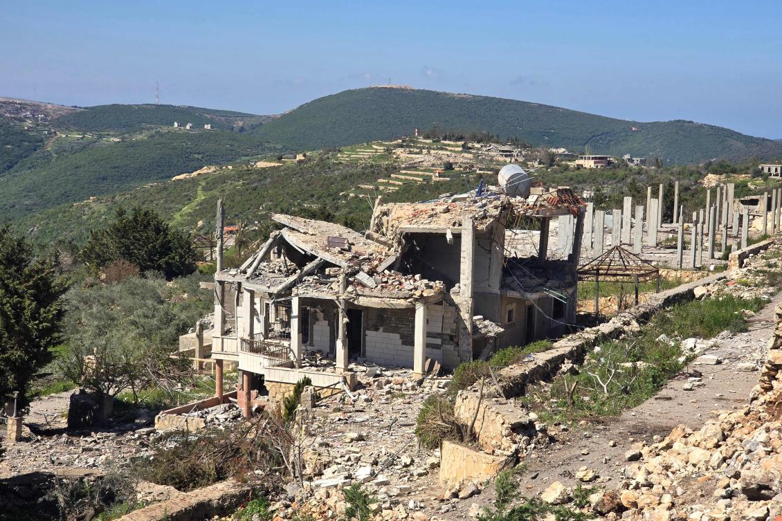 Rubbles and debris are strewn along the road at the site of a home destroyed by the Israeli army in the southern Lebanese village of Beit Lif, in the Bint Jbeil district on Apr. 22, 2026. (AFP)