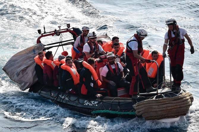 Italy’s government on Friday rushed through a decree amending rules that offered financial rewards to lawyers helping to repatriate migrants, after the scheme drew criticism from opposition parties who said it could be unconstitutional. (AFP/File)