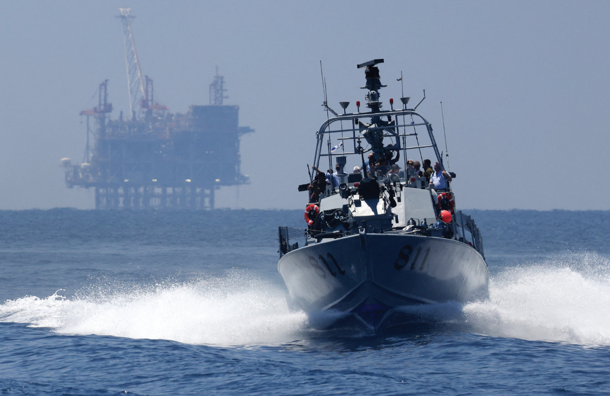 An Israeli military boat sails past the offshore Leviathan gas platform off the coast of the northern port city of Haifa, on June 24, 2021. (AFP)