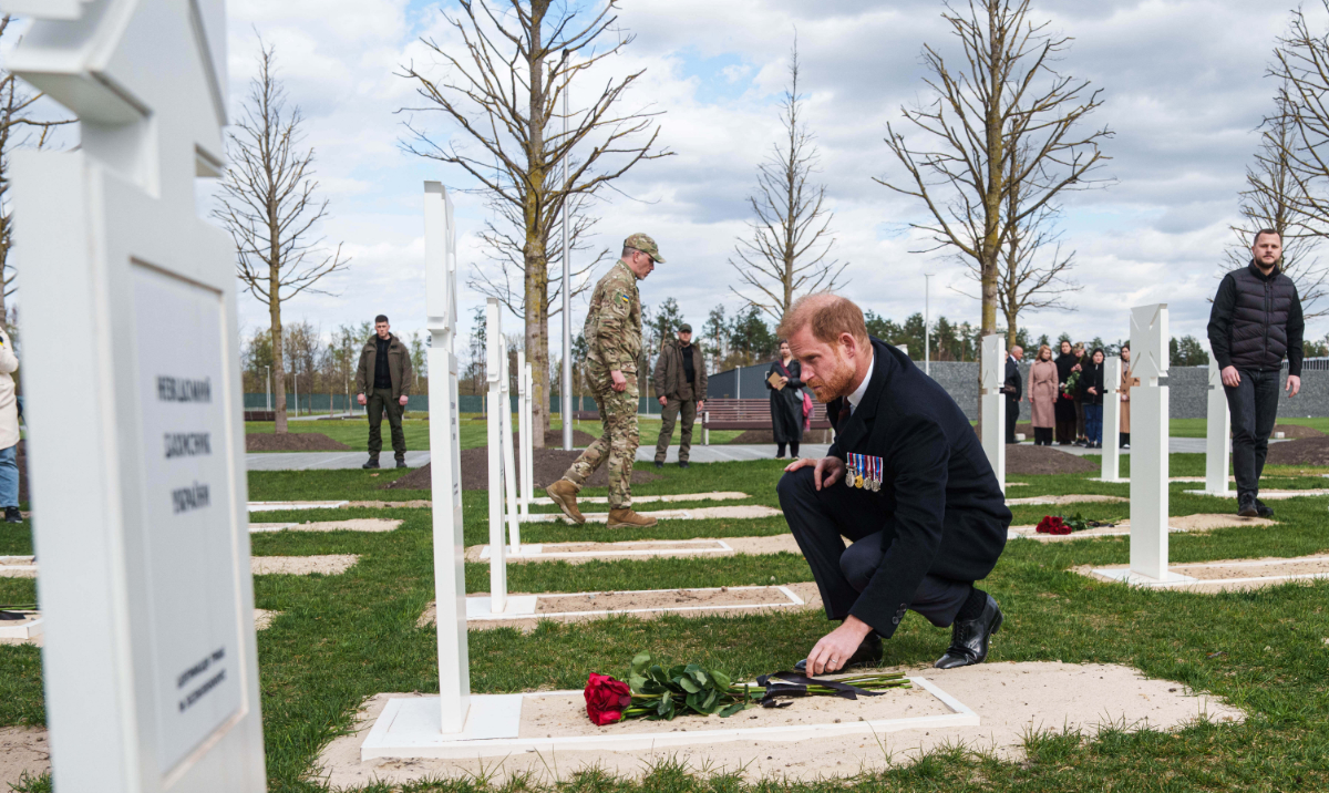 Prince Harry lays flowers at the grave of a Ukrainian soldier killed in battle at a military cemetery near Kyiv, Ukraine, on April 24. (AP)