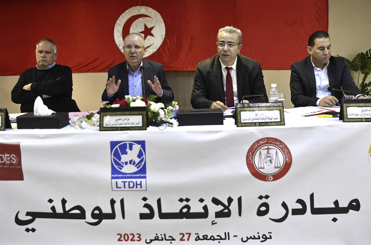 In this photo taken on January 27, 2023, Bassem Trifi (second from left), president of the President of the Tunisian Human Rights League (LTDH), speaks during a joint press conference on the national rescue initiative in Tunis. (AFP file photo)