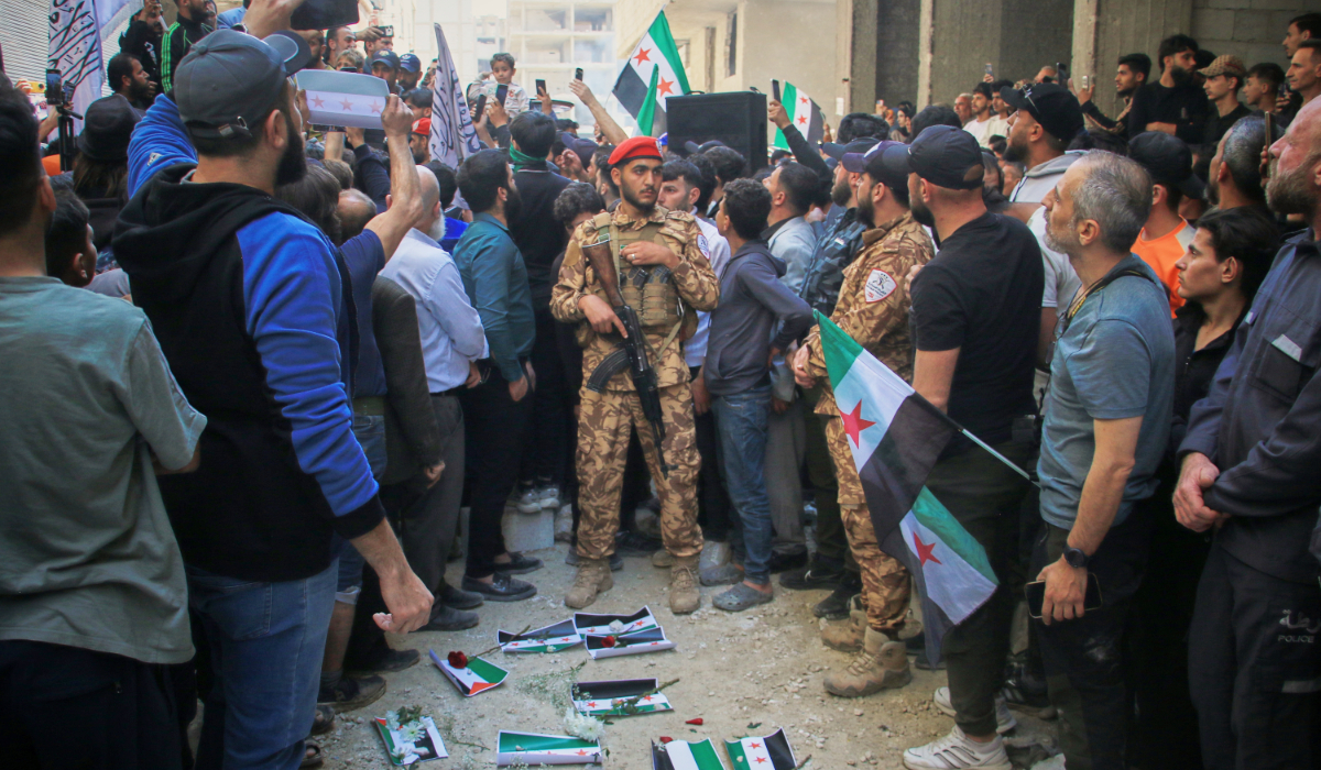 Demonstrators gather to demand the execution of Amjad Youssef, a former intelligence officer, in the Tadamon neighborhood of Damascus, Syria. (AP)