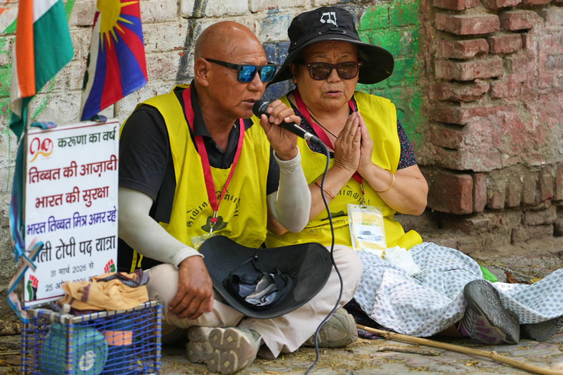 Above, Tibetan activists who marched from Dharamshala to New Delhi to protest against China adopting the “Promoting Ethnic Unity and Progress” law, pray at the conclusion of the march in New Delhi on April 24, 2026. (AP)