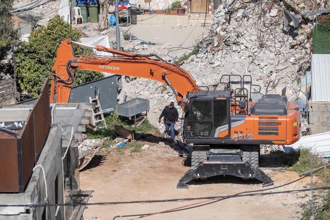 Municipal heavy machinery are seen at the Palestinian neighbourhood of Silwan, Jerusalem. (AFP)