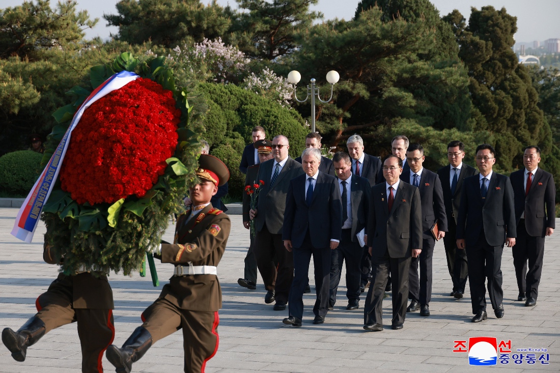 Russian Parliament speaker Vyacheslav Volodin with Jo Yong Won, chairman of the Standing Committee of North Korea's Supreme People's Assembly, walks towards the Liberation Monument to lay a wreath in Pyongyang, North Korea. (KCNA)