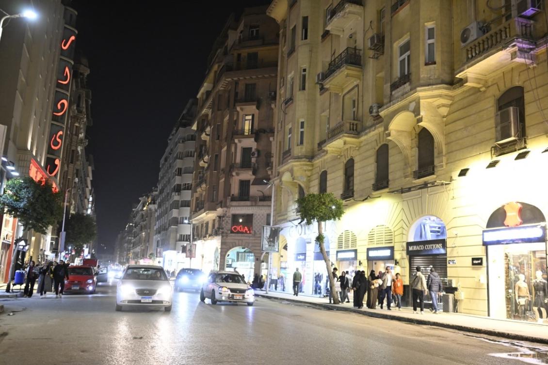 People walk before the closing of shops in downtown Cairo on April 2, 2026. (AFP)