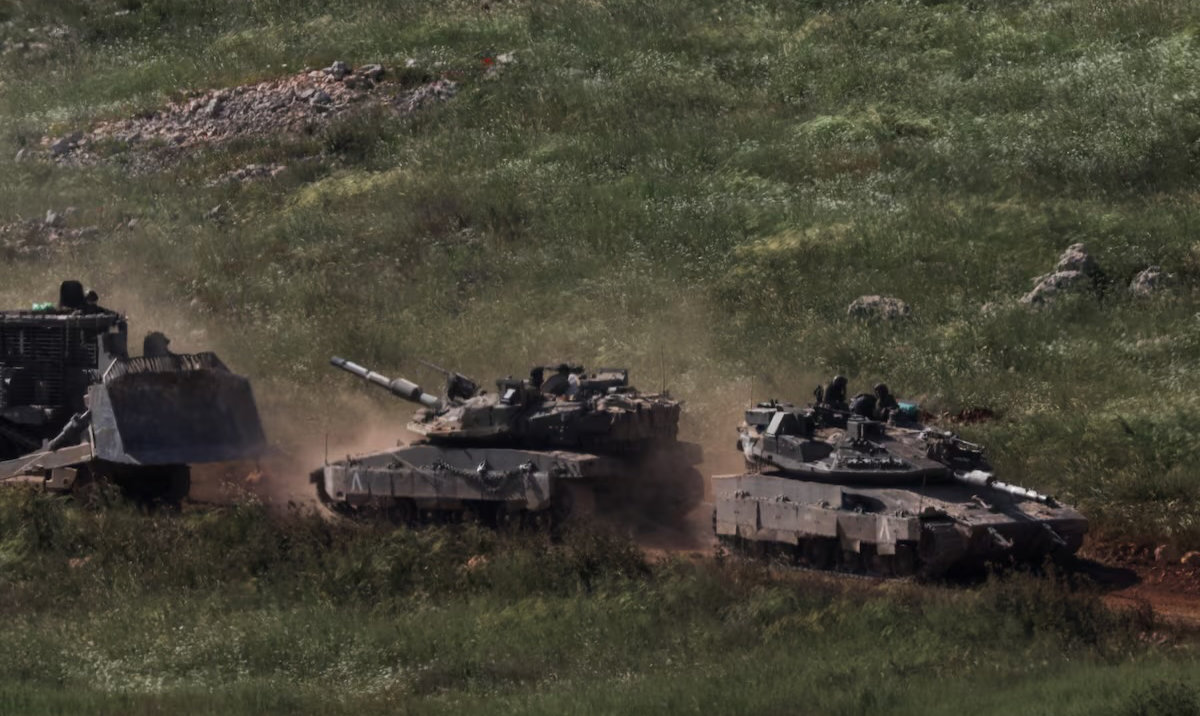 Tanks and an armoured vehicle drive in Lebanon, as seen from the Israeli side of the Israel-Lebanon border, in northern Israel, April 25, 2026. (Reuters)