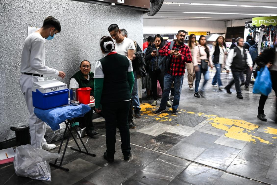People line up to receive a dose of the influenza vaccine at a subway station as part of a vaccination campaign by the Ministry of Health against measles, influenza, Covid-19 and tetanus in Mexico City on February 6, 2026. (File/AFP)