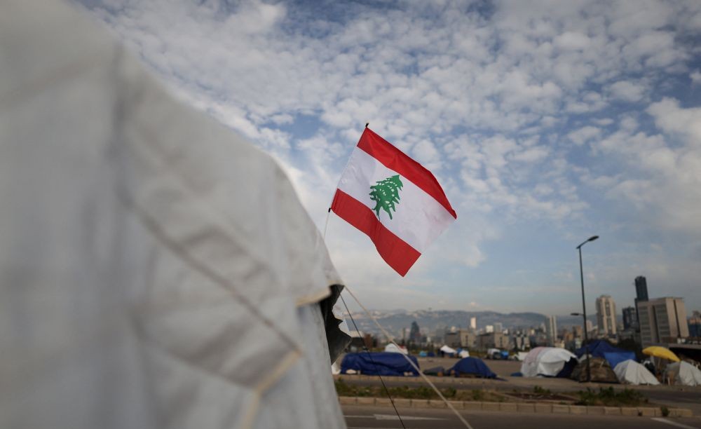 A Lebanese flag on a tent of displaced people, at a makeshift encampment, amid a temporary ceasefire between Lebanon and Israel, in Beirut, Lebanon, April 25, 2026. (Reuters)