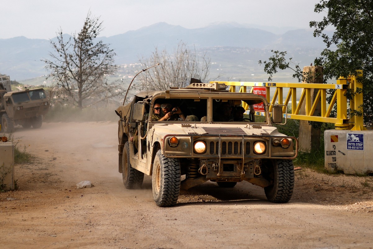 Israeli army soldiers patrol in their Humvees along the border with southern Lebanon, in the Upper Galilee of northern Israel, April 25, 2026. (Files / AFP)