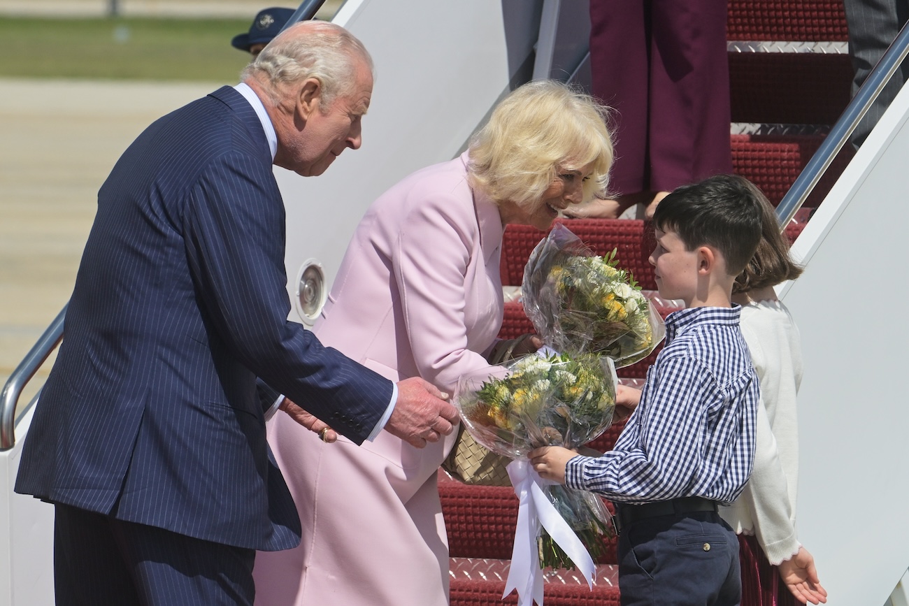 King Charles III and Queen Camilla receive posies from the children of British military families based in the United States, at Joint Base Andrews, Md., Monday, April 27, 2026. (AP)