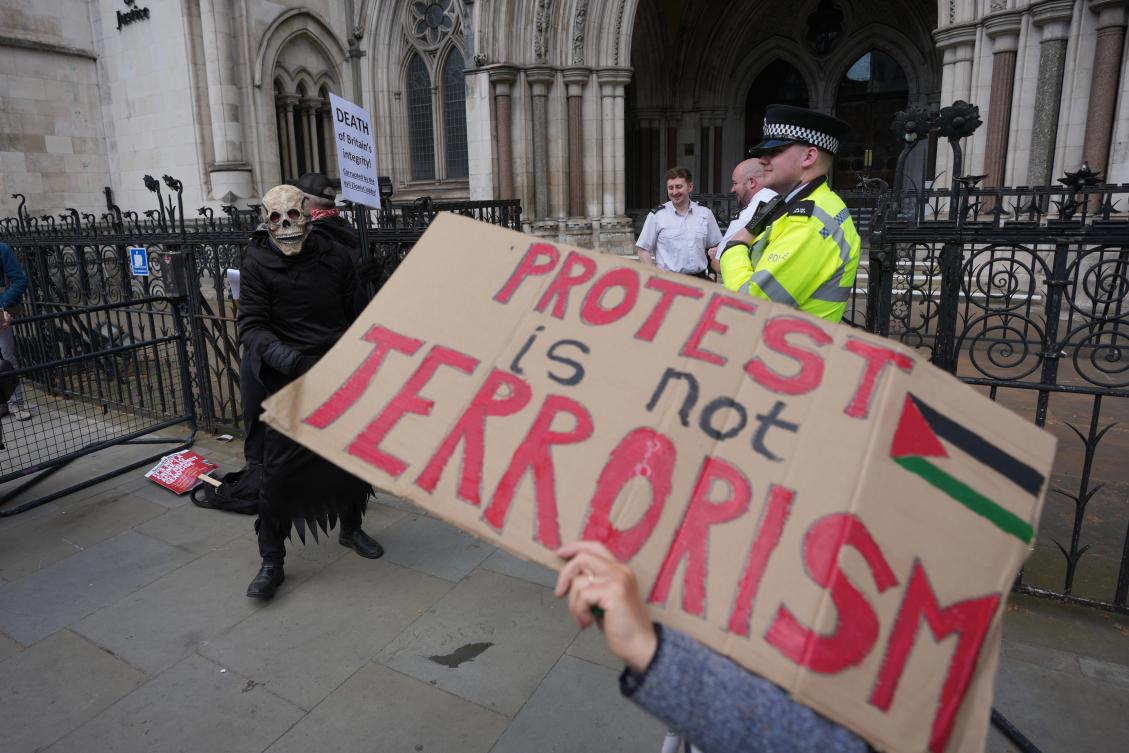 Supporters of Palestine Action stage a protest outside the Royal Court of Justice in London, on Tuesday. (AP)