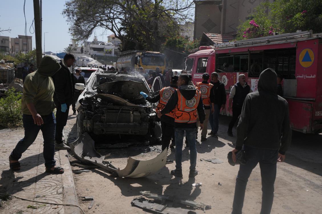 Palestinian civil defense crews work on a destroyed car after it was struck in an Israeli strike in Gaza City Tuesday, April 28, 2026. (AP)