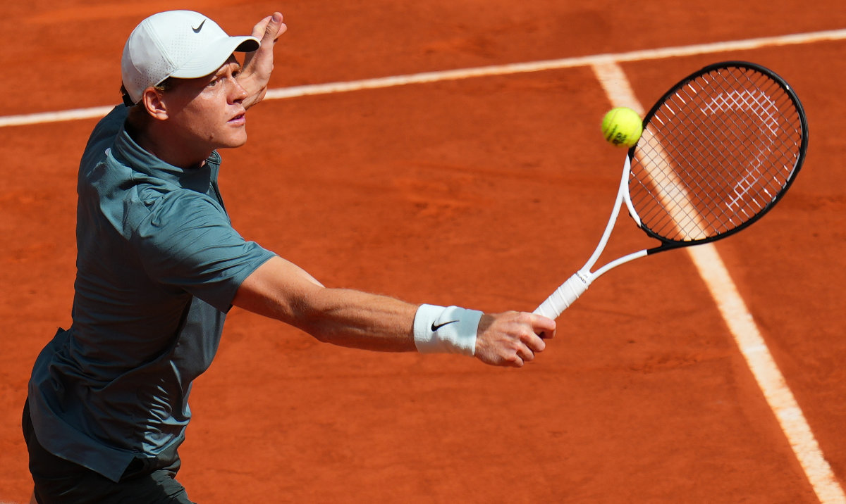 Jannik Sinner of Italy returns the ball to Cameron Norrie of Britain during their round of 16 match at the Madrid Open tennis tournament in Madrid, Tuesday, April 28, 2026. (AP)