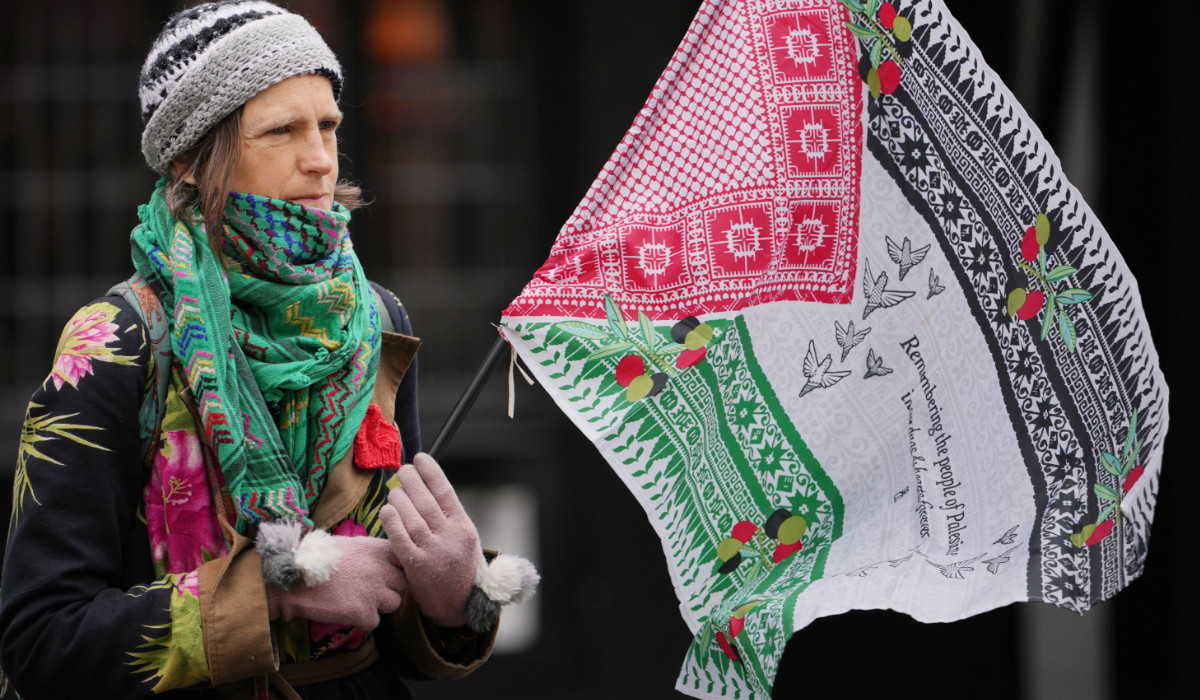 A supporter of Palestine Action stages a protest outside the Royal Court of Justice in London, Tuesday, April 28, 2026. (AP)