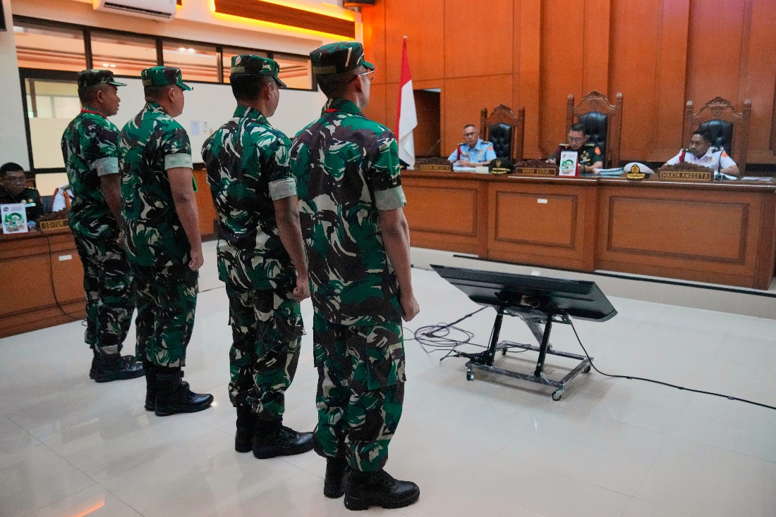 Indonesian military personnel accused of carrying out an acid attack on human right activist Andrie Yunus, stand in attention during their trial at a military court in Jakarta, Indonesia. (AP)