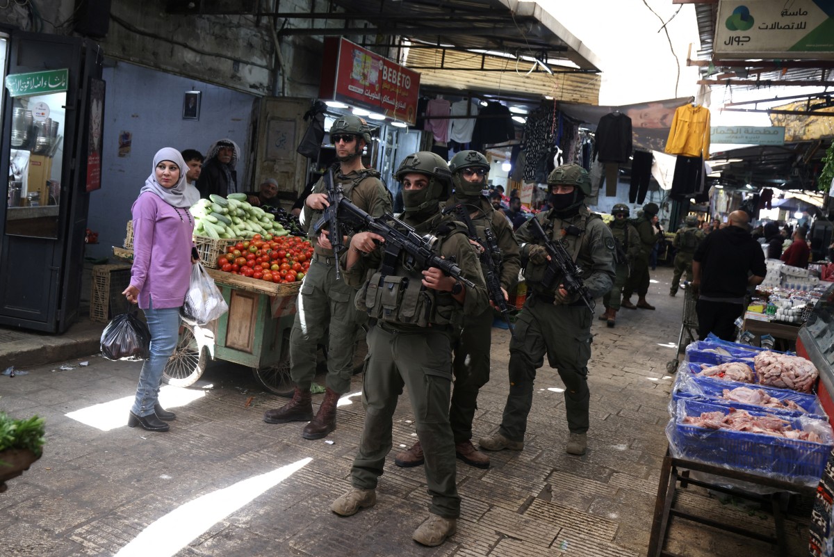 Israeli soldiers patrol the market in the Old City of Nablus, in the northern Israeli-occupied West Bank on April 27, 2026. (AFP)