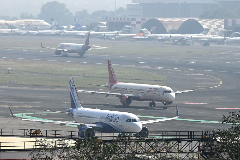 Aircraft of Indian airlines IndiGo and Air India prepare to take off at the Chhatrapati Shivaji Maharaj International Airport in Mumbai on Dec. 8, 2025. (AFP)