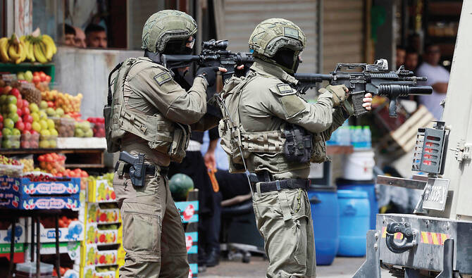 Israeli troops in the Palestinian city Nablus in the occupied West Bank last year. More than 40 Palestinians have been killed by Israeli settlers and soldiers, since Jan. 1. (AFP/File)