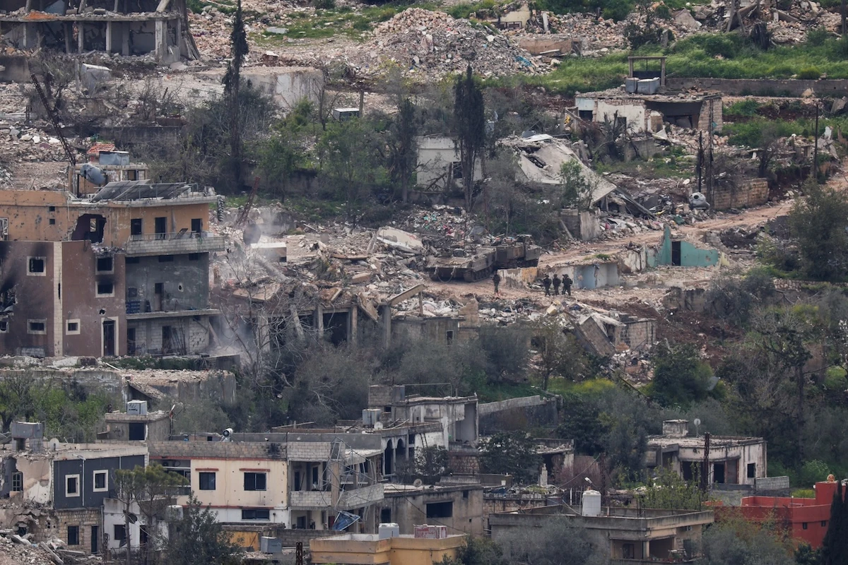 Israeli soldiers walk among destroyed buildings in southern Lebanon, near the Israel-Lebanon border, April 14, 2026. (Reuters)