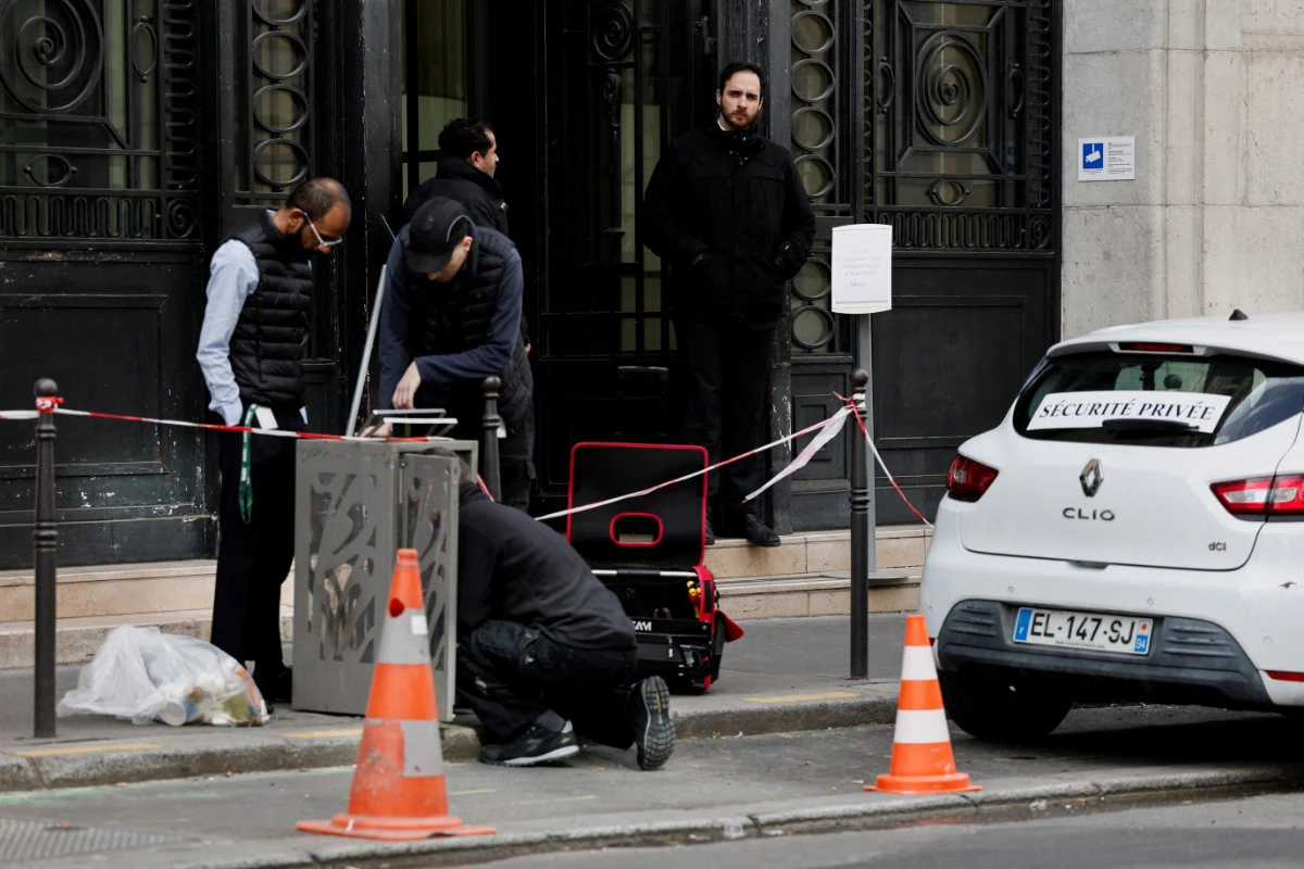 Private security members stand outside Bank of America's Paris offices, after French anti-terrorism prosecutors opened an investigation into attempted destruction by fire or other dangerous means in Paris on March 30, 2026. (REUTERS)