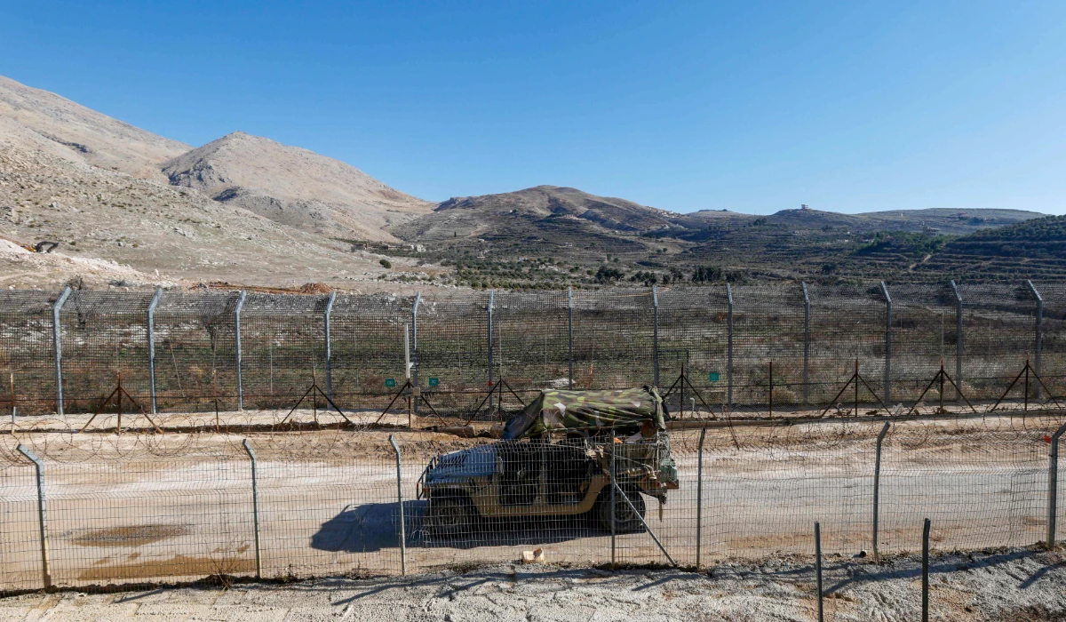 An Israeli army jeep drives in the buffer zone, which separates Israeli and Syrian forces on the Golan Heights, near the Druze village of Majdal Shams in the Israel-annexed Golan Heights on December 14, 2024. (AFP)