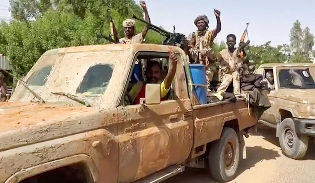 In this image grab taken from handout video footage released by the Sudanese paramilitary Rapid Support Forces (RSF) on April 23, 2023, fighters ride in the back of a technical vehicle in the East Nile district of greater Khartoum. (AFP file photo)