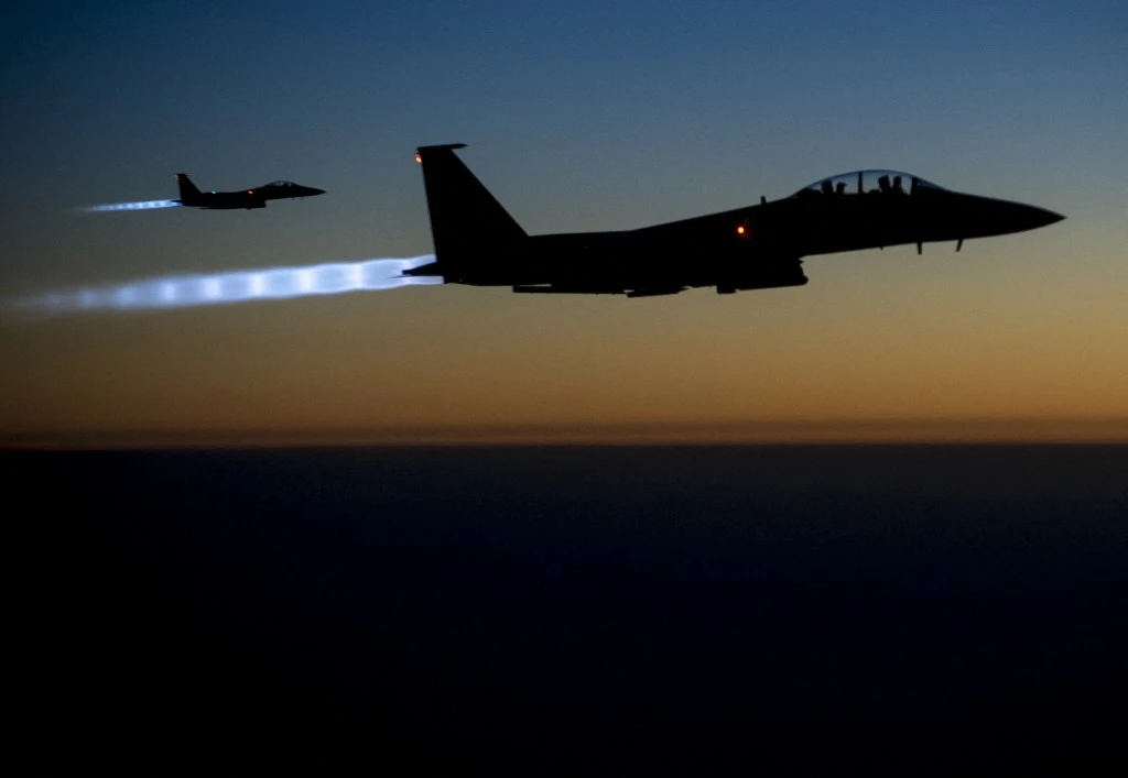 Above, a pair of US Air Force F-15E Strike Eagles flying over northern Iraq on Sept. 23, 2014. A similar warplane was shot down over Iran. (US Air Forces Central Command via DVIDS/AFP file photo)