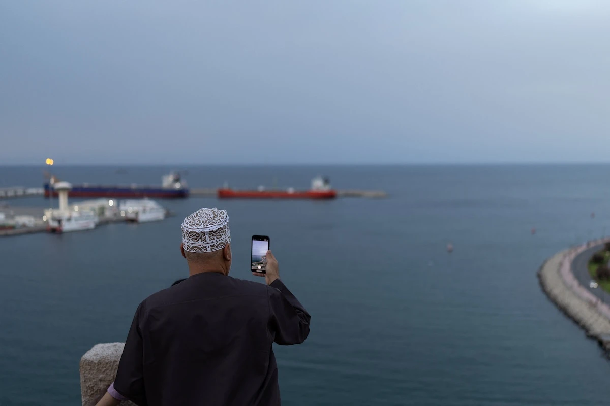 Above, vessels sit at anchor in Sultan Qaboos Port in Muscat, Oman on March 26, 2026 as Iran continues to restrict maritime traffic at the Strait of Hormuz. (Reuters)