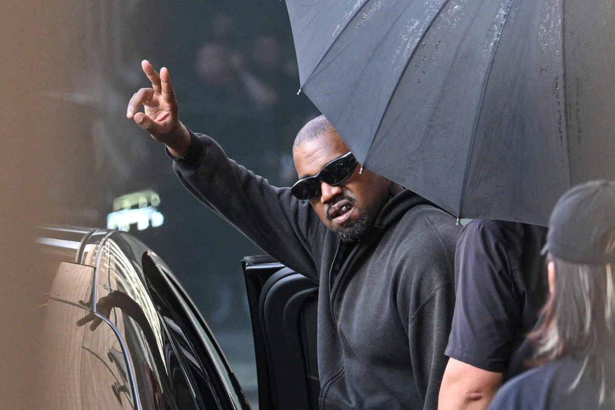 US rapper and producer Kanye West gestures upon arriving at Shanghai Pudong International Airport, China. (AFP)