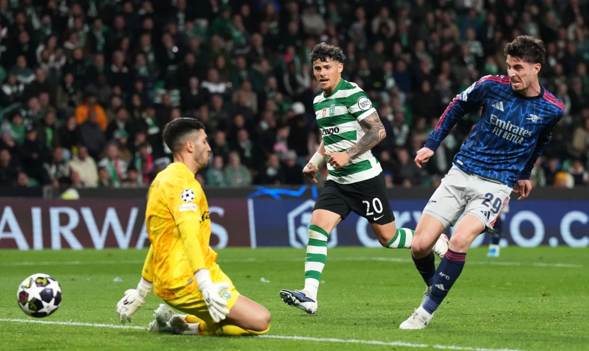Sporting's Maximiliano Araujo, center, watches as Arsenal's Kai Havertz scores his sides first goal past Sporting's goalkeeper Rui Silva during the Champions League quarterfinals, first leg, soccer match between Sporting CP and Arsenal, in Lisbon, Tuesday, April 7, 2026. (AP)