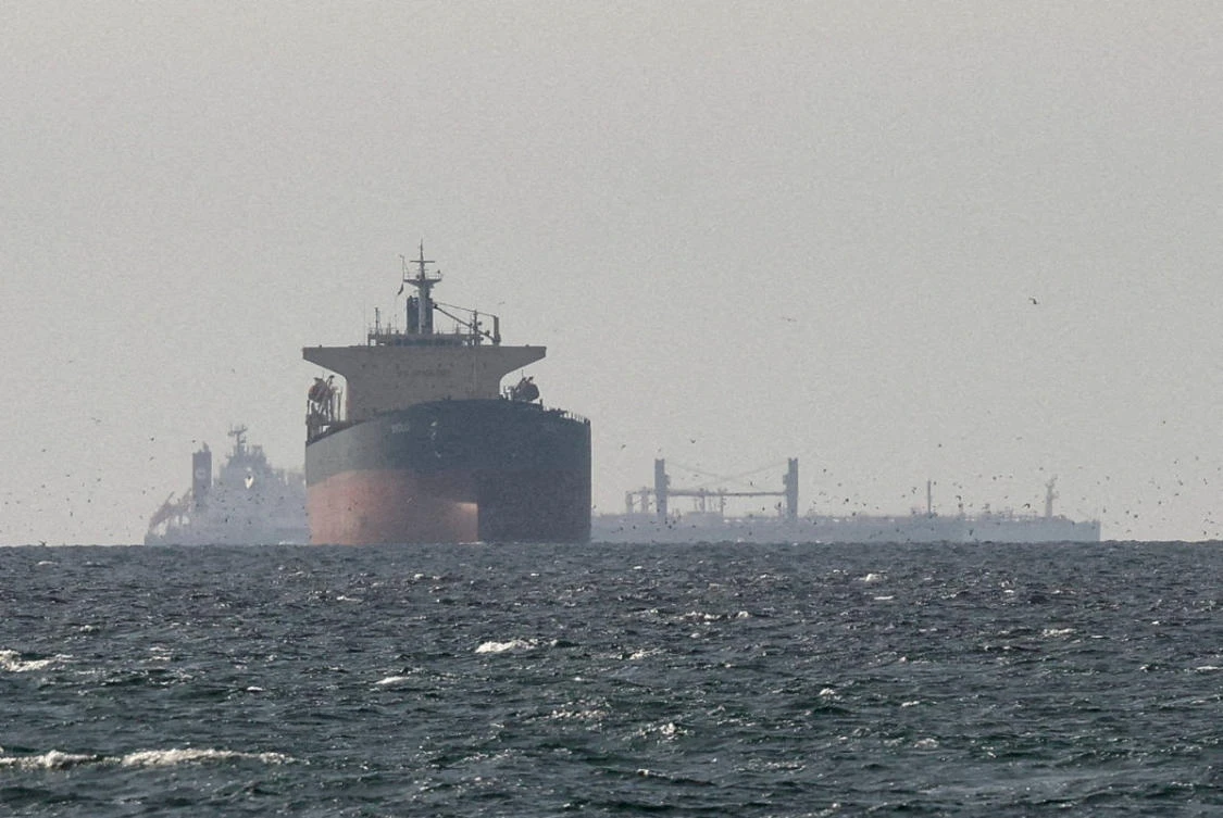 Cargo ships in the Gulf, near the Strait of Hormuz, as seen from northern Ras al-Khaimah, near the border with Oman's Musandam governanc. (REUTERS/Stringer/File Photo/)