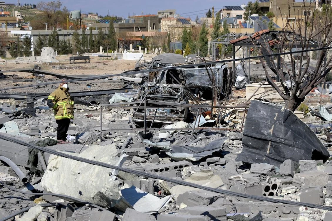 A civil defence member inspects destroyed vehicles and rubble and debris in the aftermath of Israeli bombardment on the village of Shmistar in the centre of Lebanon's eastern Bekaa valley on April 8, 2026. (FILE/AFP)