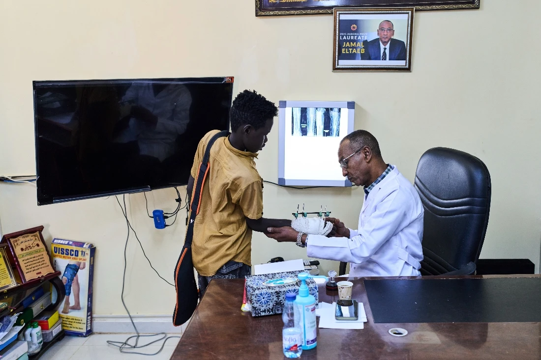 Dr. Jamal Eltaeb checks a patient at Al Nao Hospital in Omdurman, on the outskirts of Khartoum, Sudan. (AP)