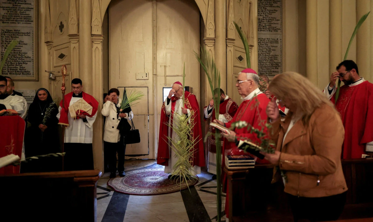 Christian worshippers mark Palm Sunday, following the cancellation of traditional Palm Sunday procession. (Reuters)