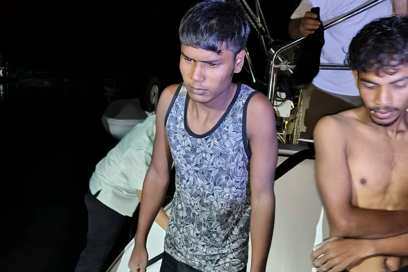 This photo shows migrants handed over to authorities after they were rescued by a sailboat, in waters off northern resort island of Langkawi, Malaysia, Nov. 8, 2025. (AP)
